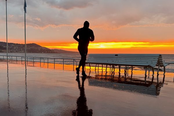 Runner at sunset on the Promenade des Anglais, Nice — French Riviera